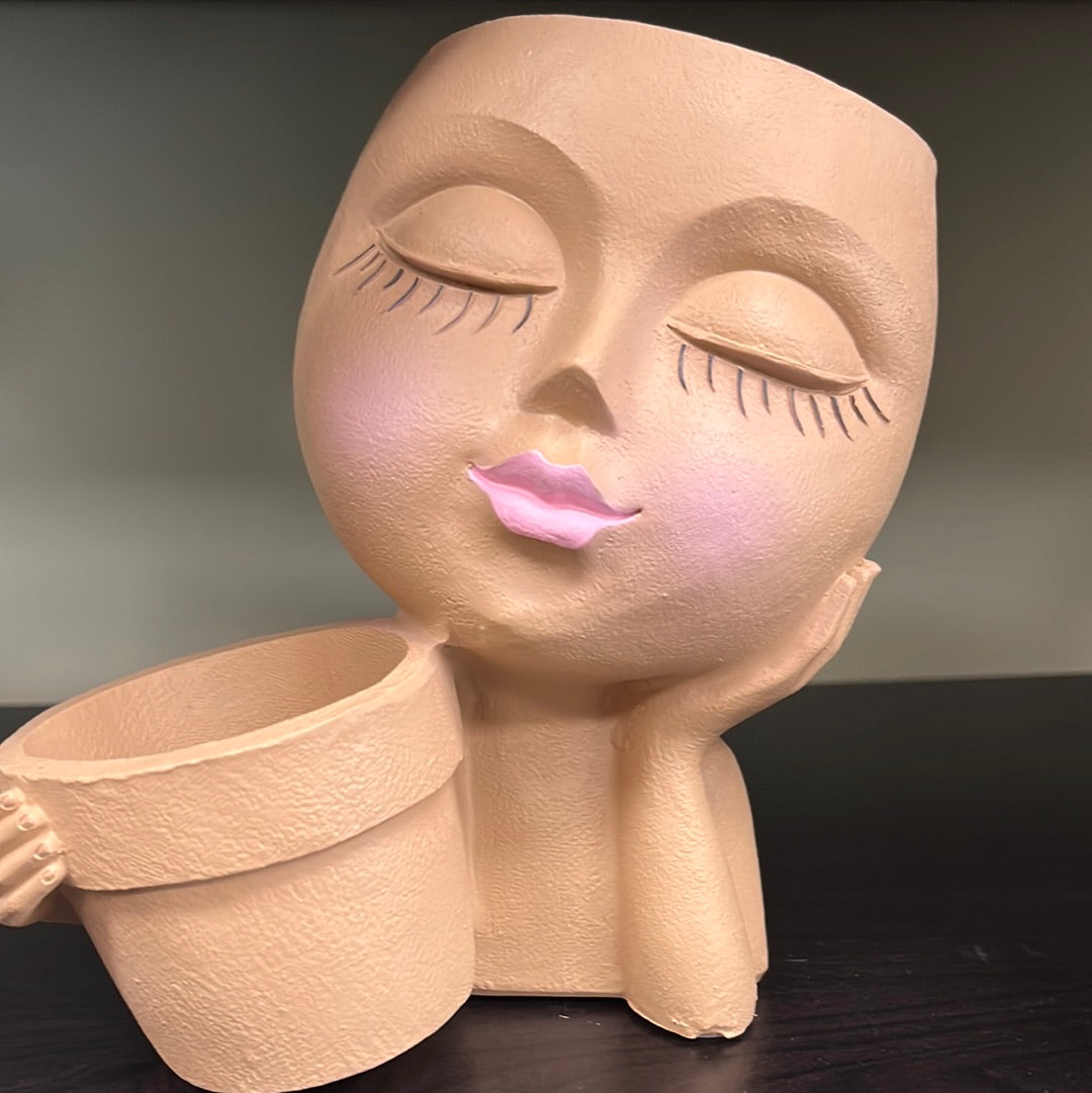 Face Planter Holding Flower Pot
